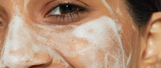 woman with cleanser on face