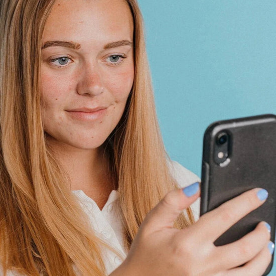 woman holding phone