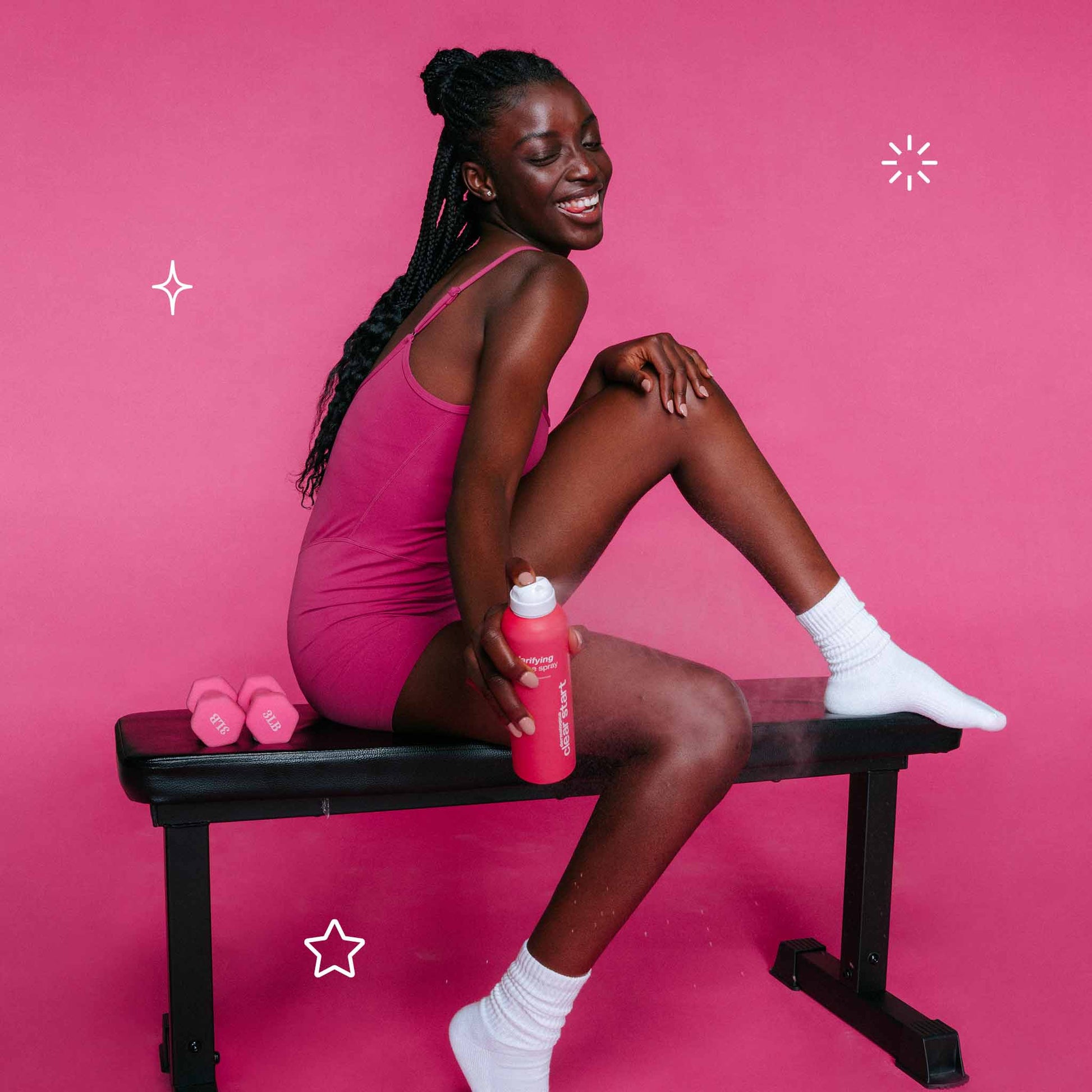 model holding clarifying bacne spray