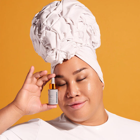 Patrick Starrr holding Biolumin C Night Restore