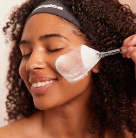 woman receiving treatment with fan brush