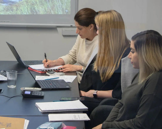 dermalogica employees at conference meeting