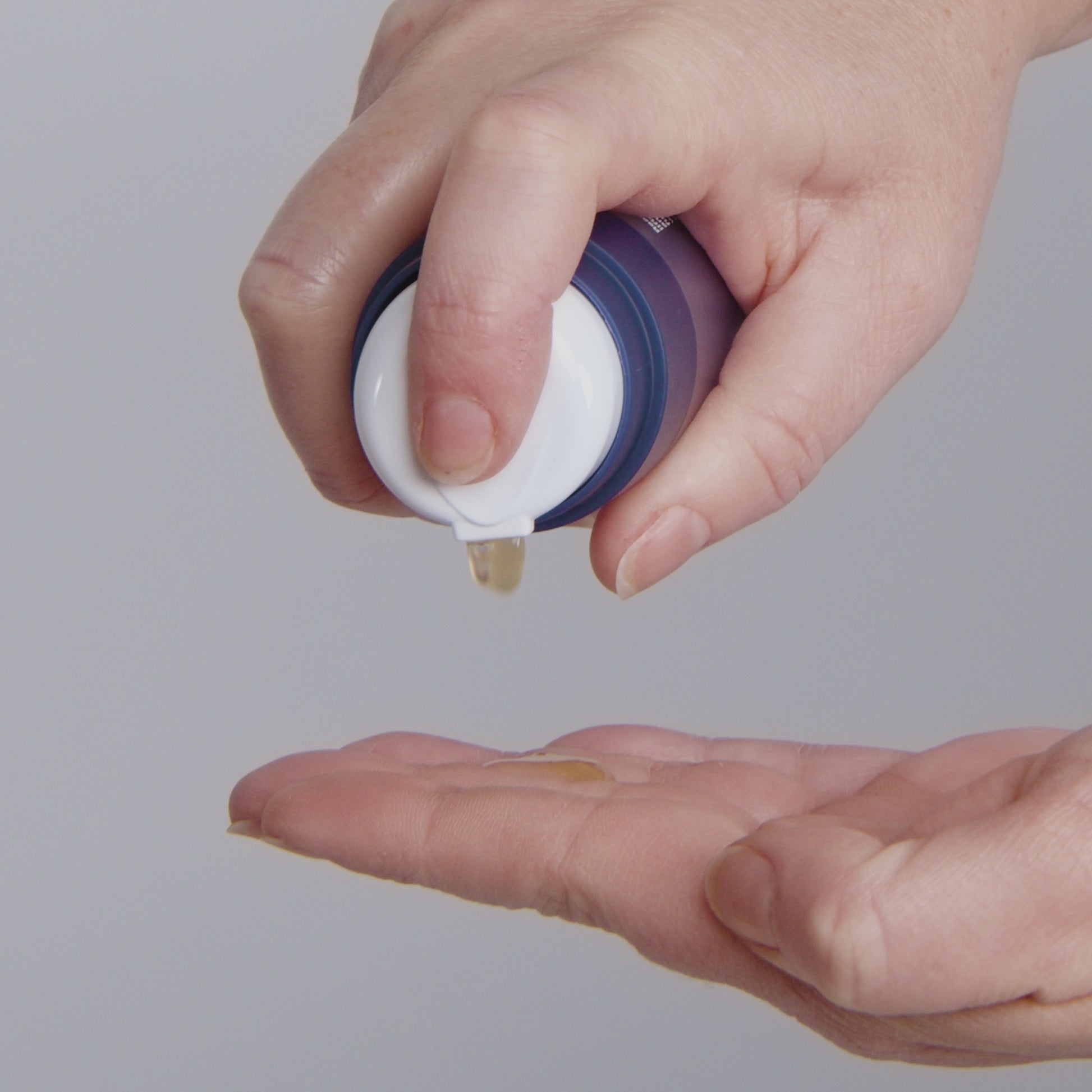 women applying phyto nature firming serum to face