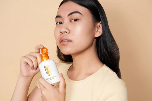 girl holding clear start bottle