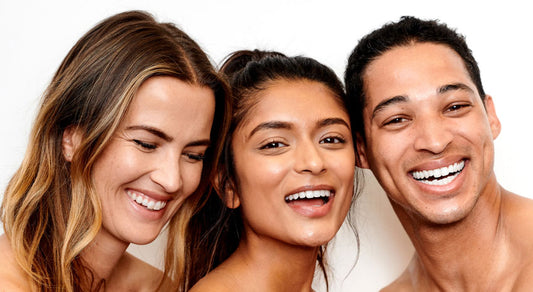 two women and one man smiling