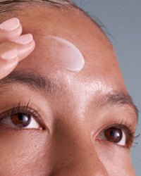 model with pro-collagen banking serum on skin collagen 101 ➔