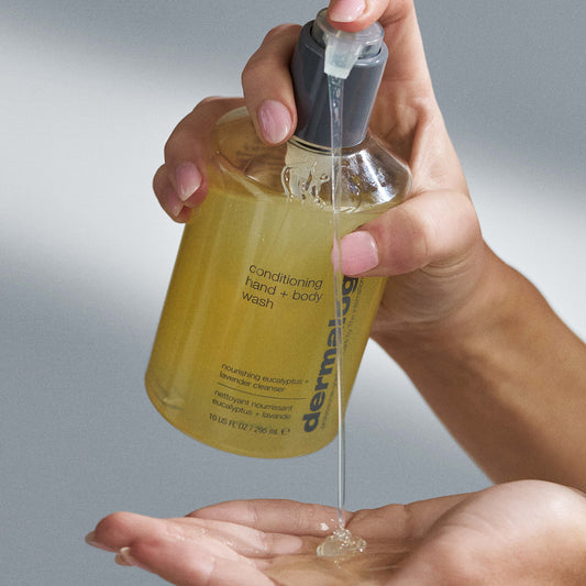 Dermalogica conditioning hand and body wash bottle on a light gray background with listed benefits.