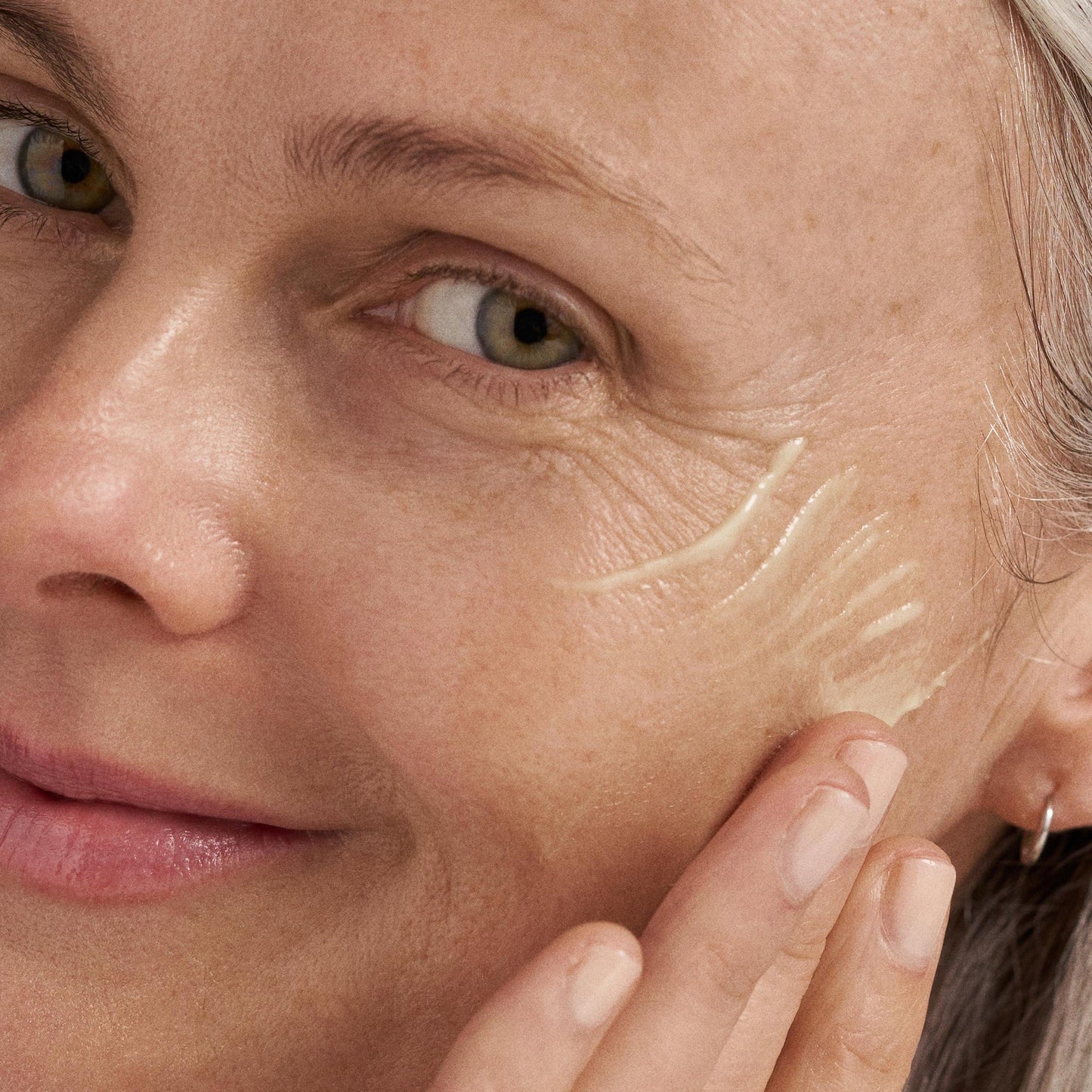 model applying dynamic skin retinol serum 