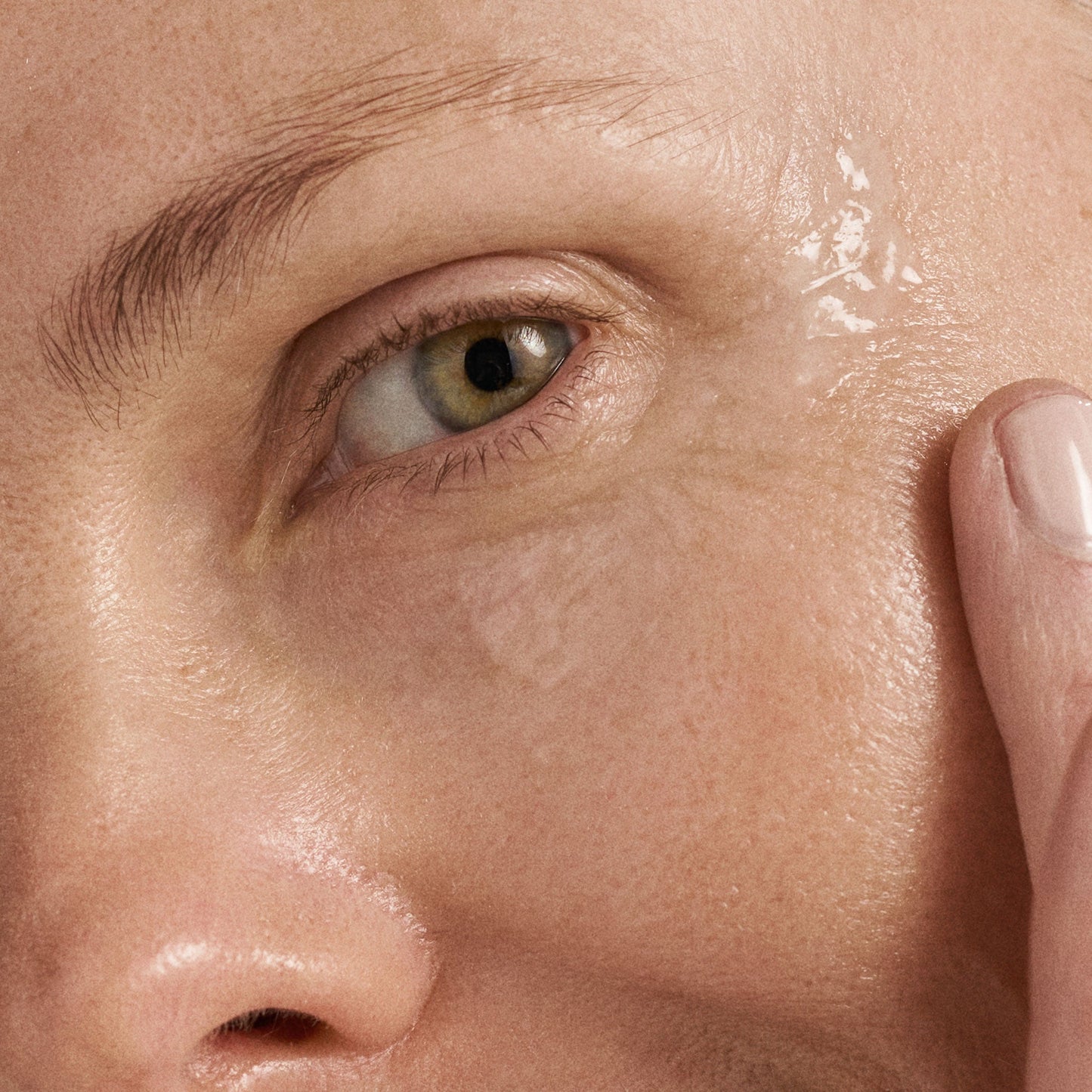 model applying multivitamin power firm eye cream 