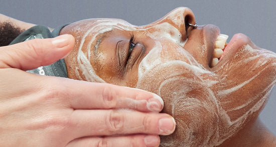 model receiving facial treatment
