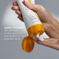 Hand applying sunscreen cream from a tube with text about water resistance and broad spectrum protection.