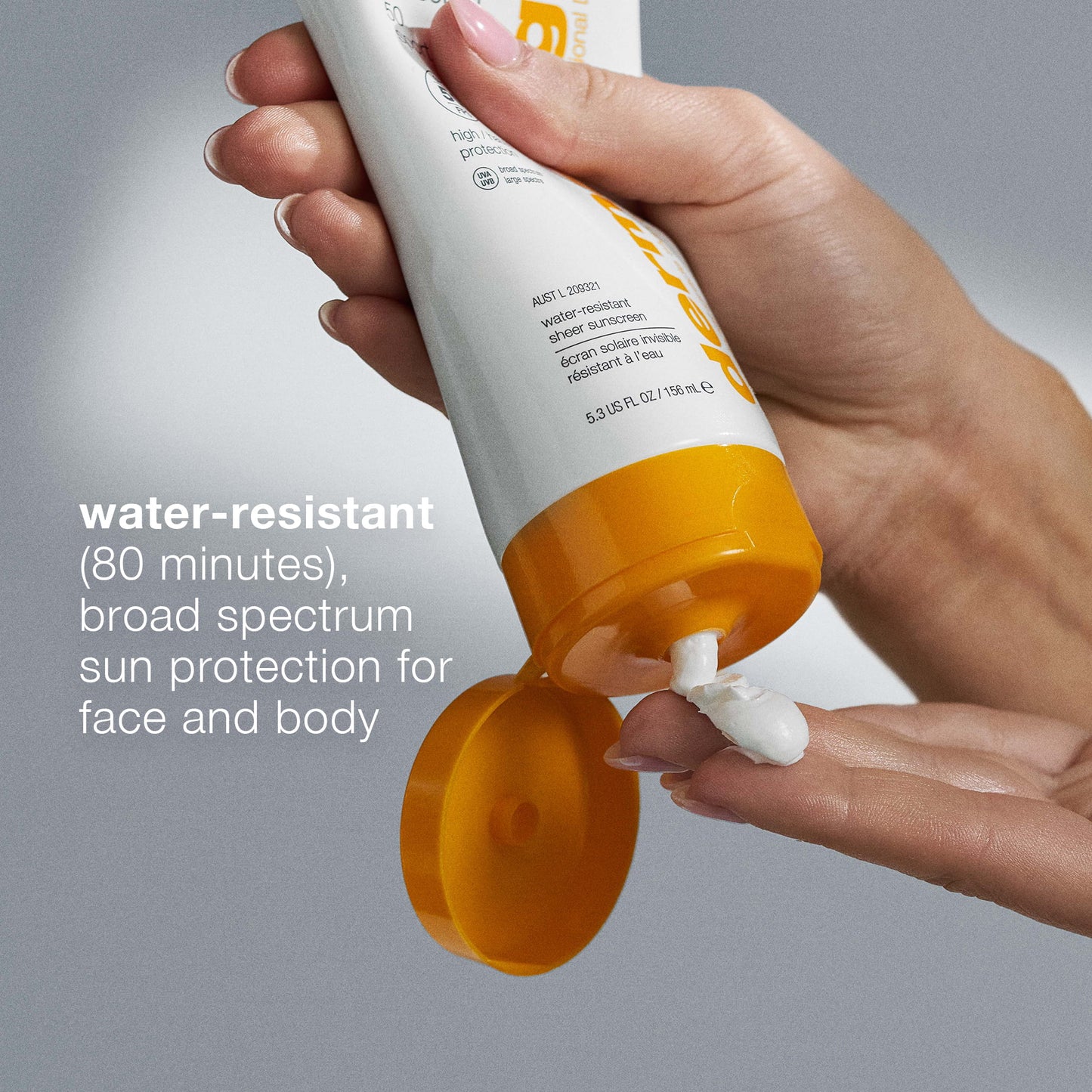 Hand applying sunscreen cream from a tube with text about water resistance and broad spectrum protection. 