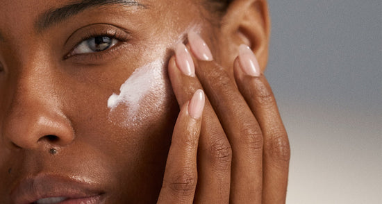 model applying product to skin