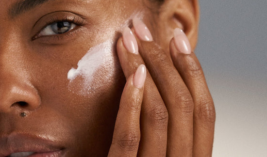  model applying product to skin 