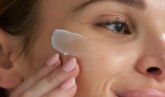 model applying product to skin