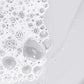 Close-up of soap bubbles on a white surface