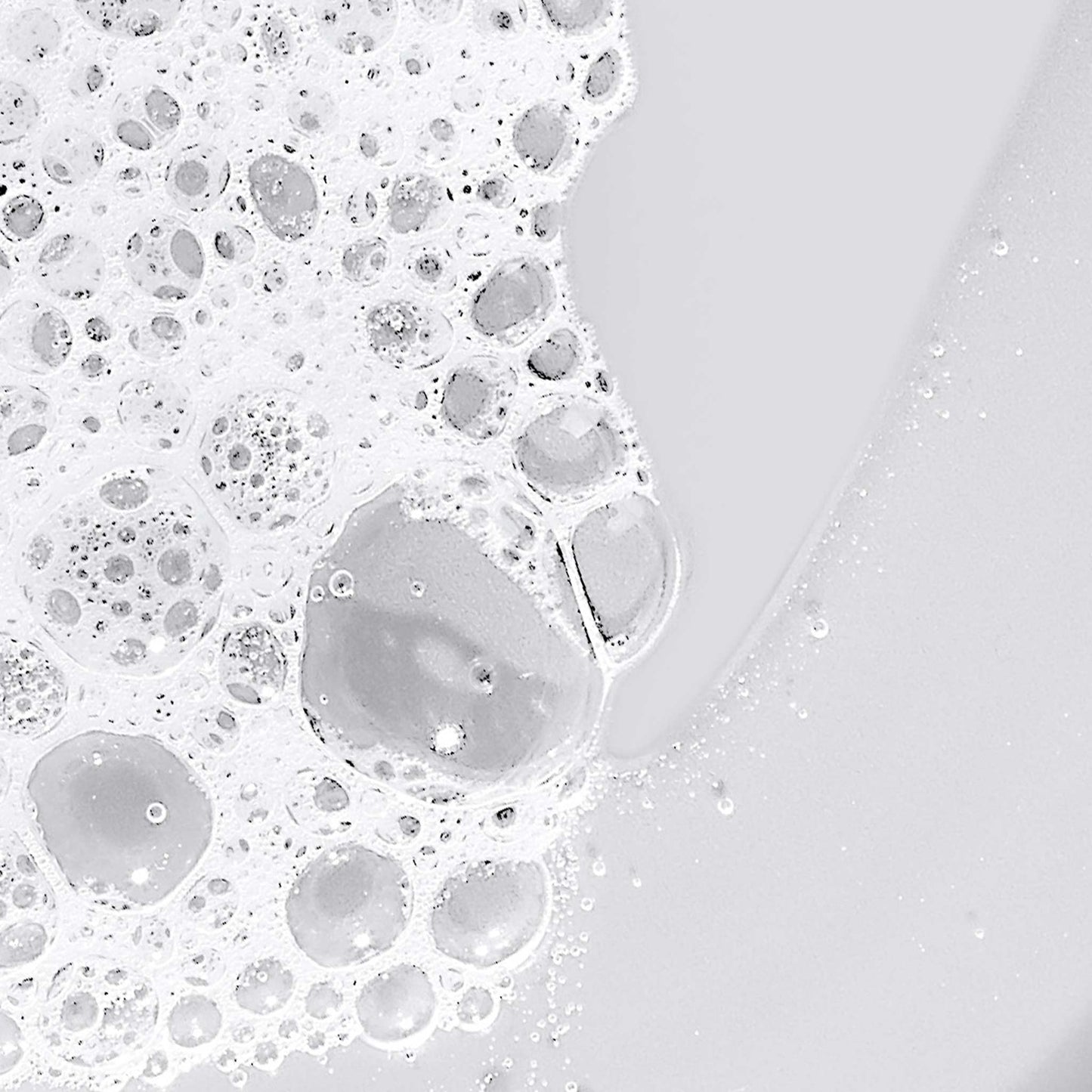 Close-up of soap bubbles on a white surface 