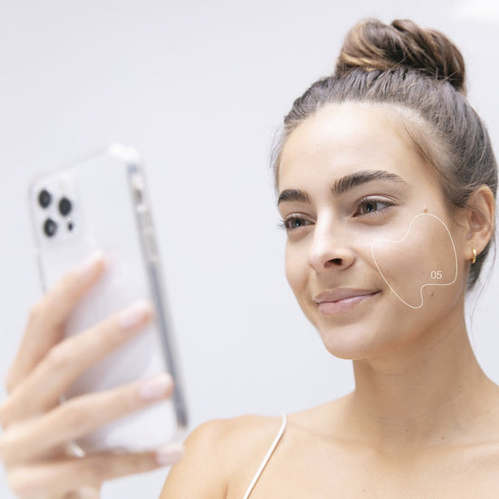 woman holding phone
