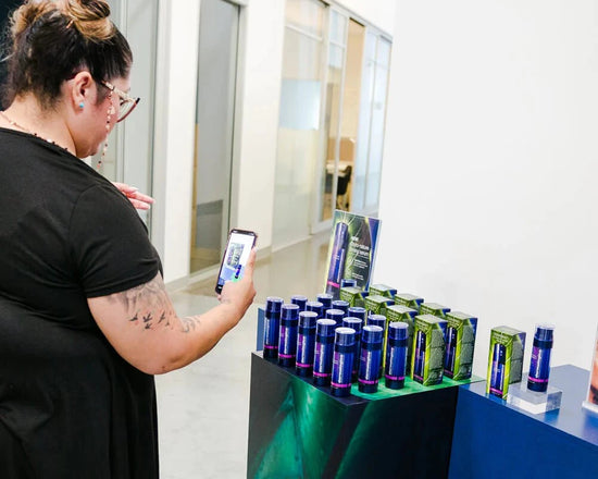 woman taking photos of phyto nature firming serum bottles