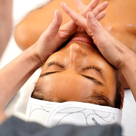 woman receiving treatment on face