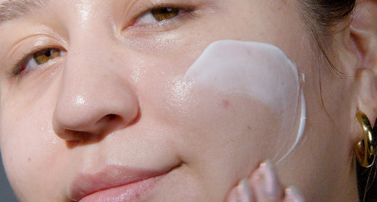 model applying product to face