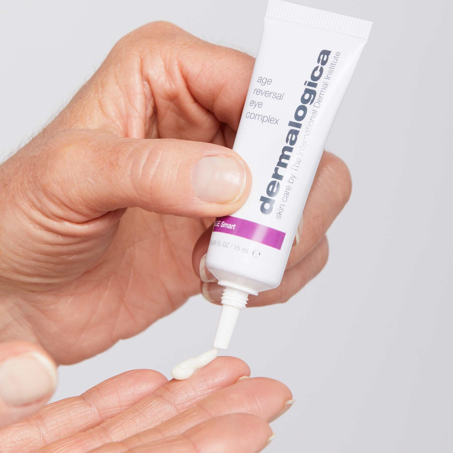 age reversal eye complex being dispensed onto fingertip