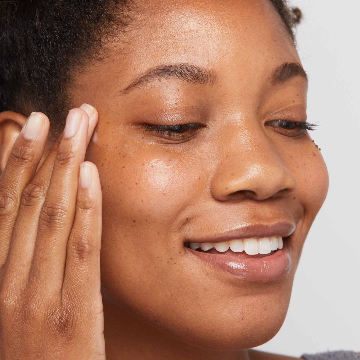 woman applying biolumin-c eye serum 