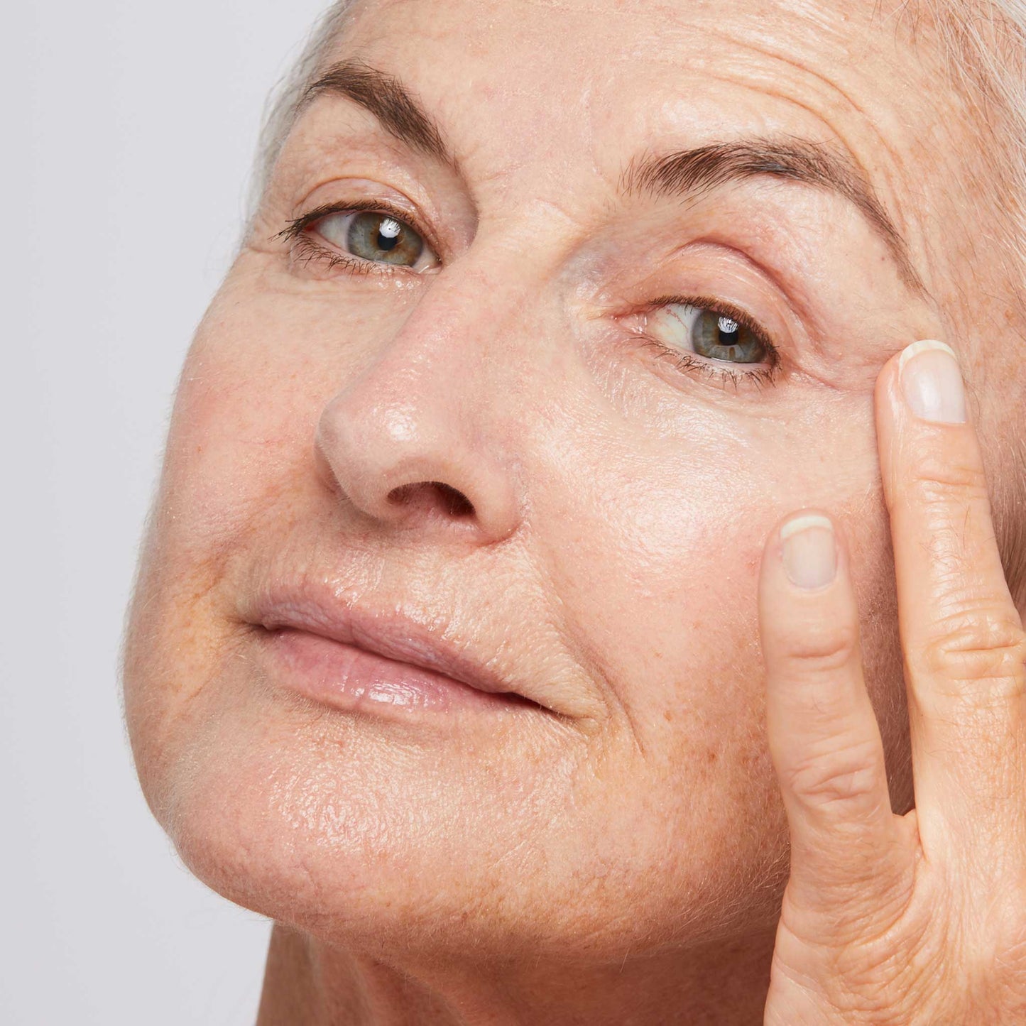 woman applying multivitamin power firm 