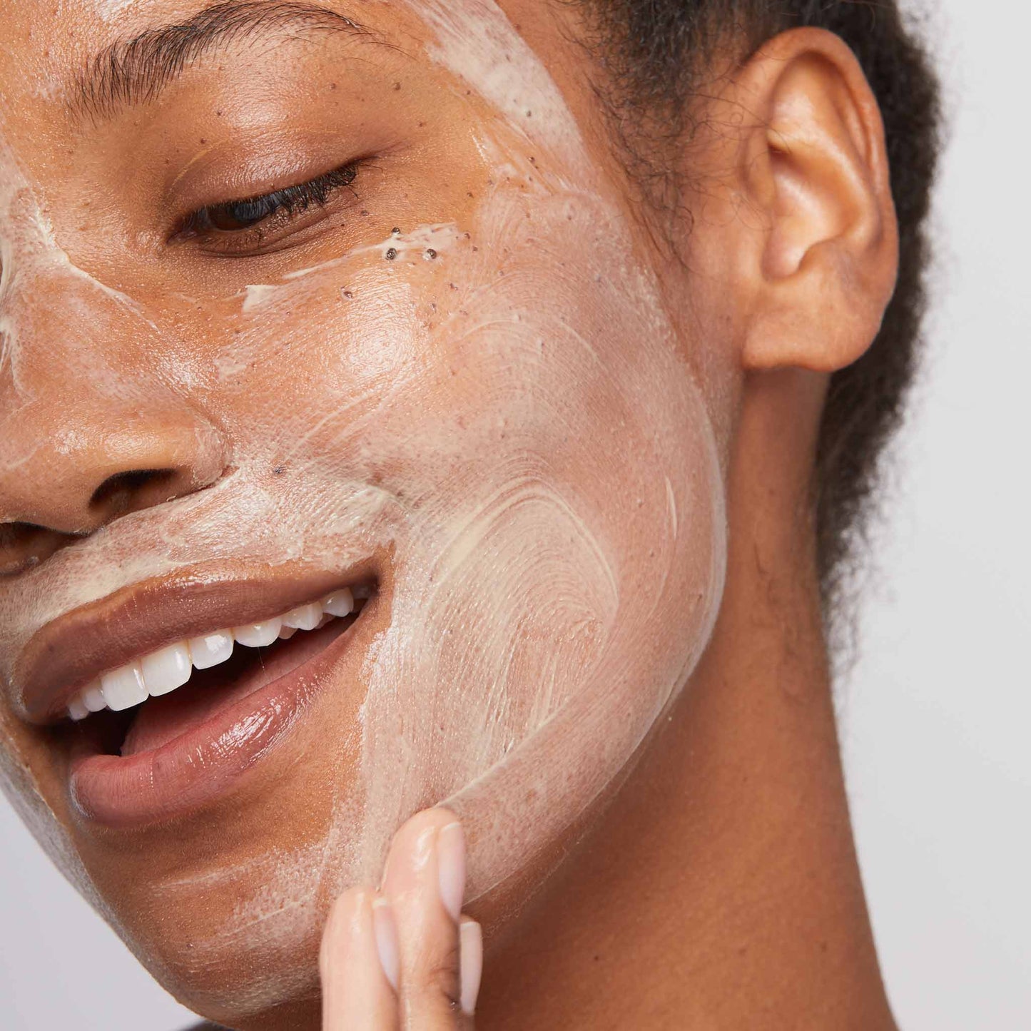 woman applying multivitamin power recovery masque