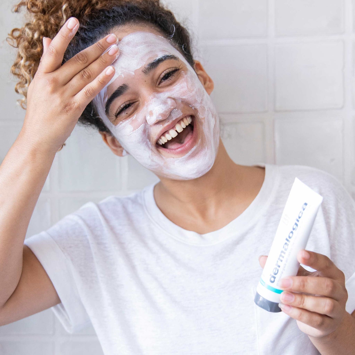 woman applying sebum clearing masque