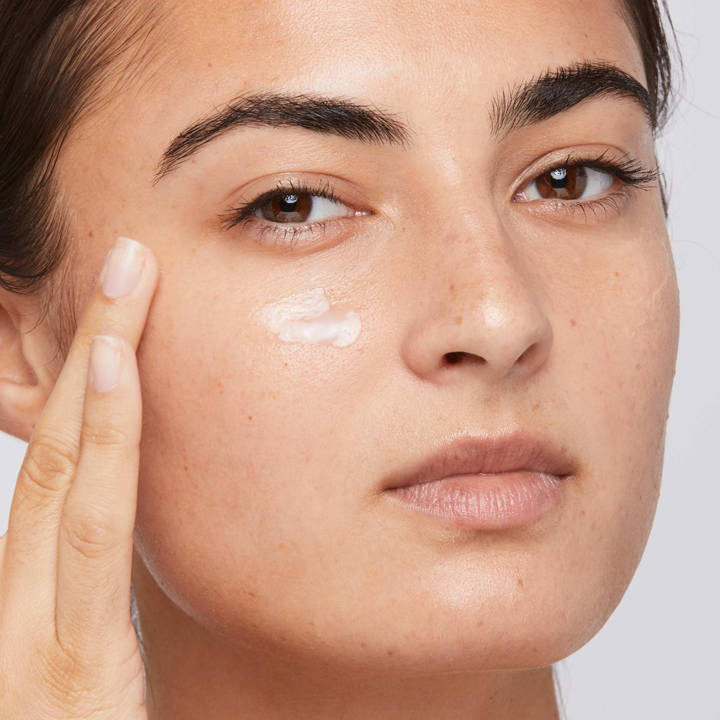 woman rubbing in stress positive eye lift 