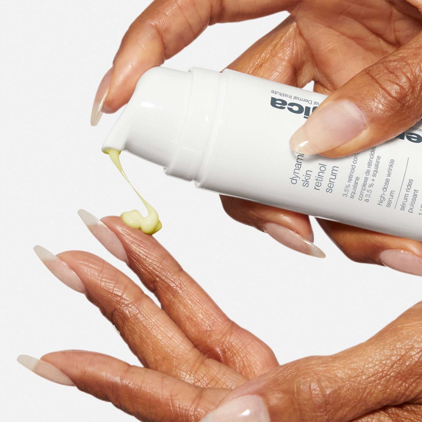 dynamic skin retinol serum being dispensed onto fingertips